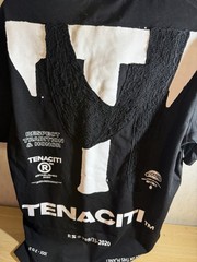 Tenaciti Studios t-shirt features a large fuzzy “T” logo on the right chest SZ S
